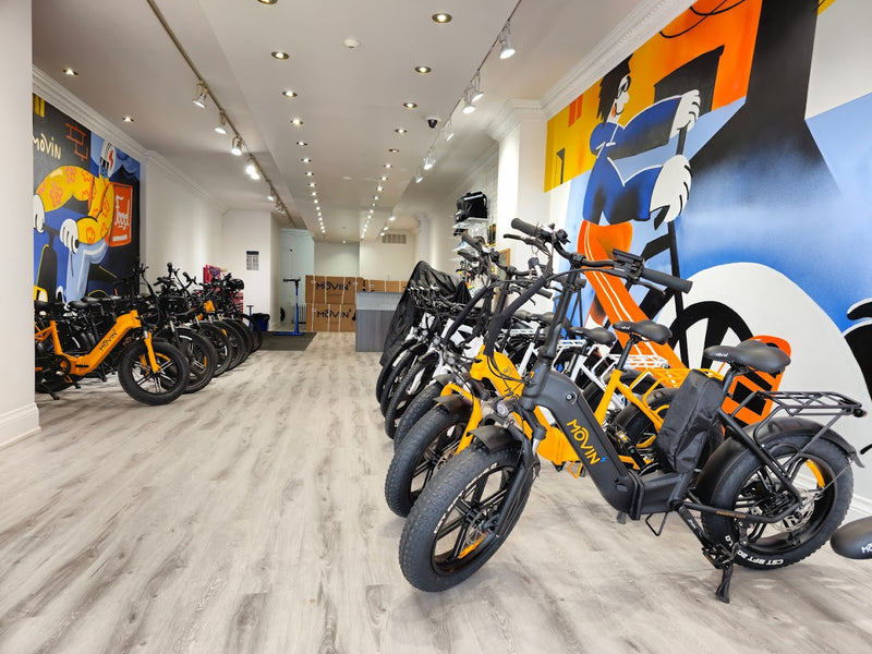 Movin electric bike showroom in Toronto with fat-tire e-bikes and colorful mural walls