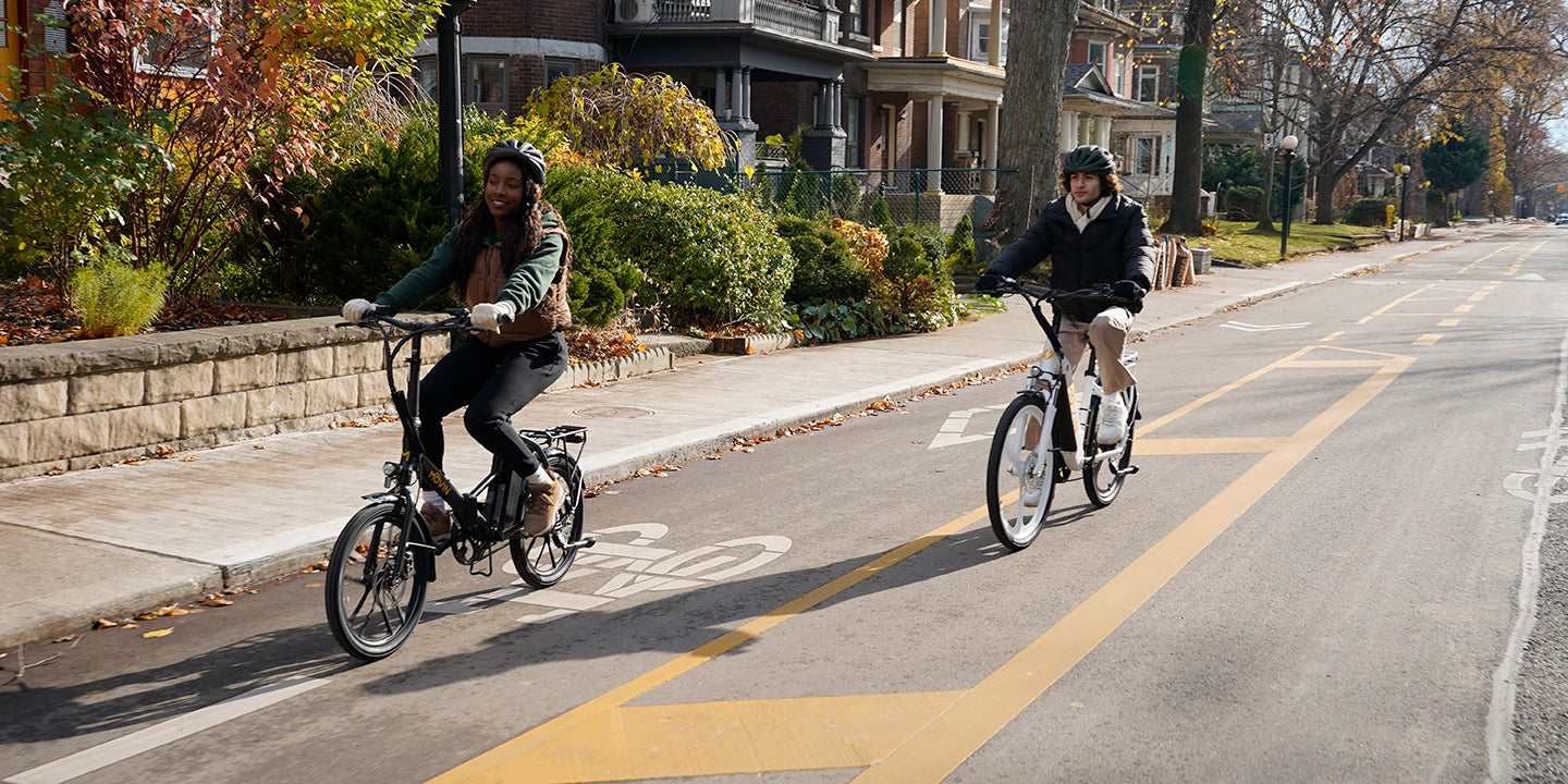 People riding Movin e-bikes together, showcasing urban mobility and eco transport