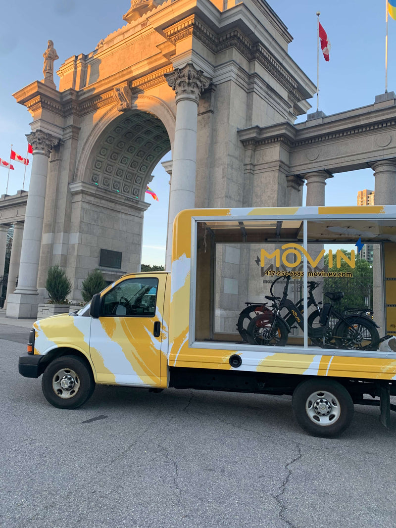 Mobile advertising trailer showcasing Movin electric bikes for promotional display