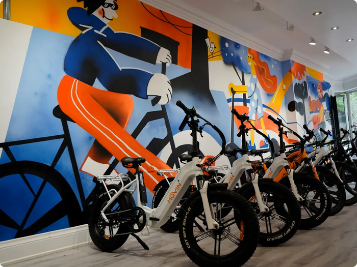 White Movin Pulse electric bike on display in showroom sales area ready for purchase